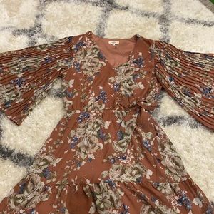 Perfect for Spring! Brownish-mauve faux wrap dress with bell sleeves. Medium